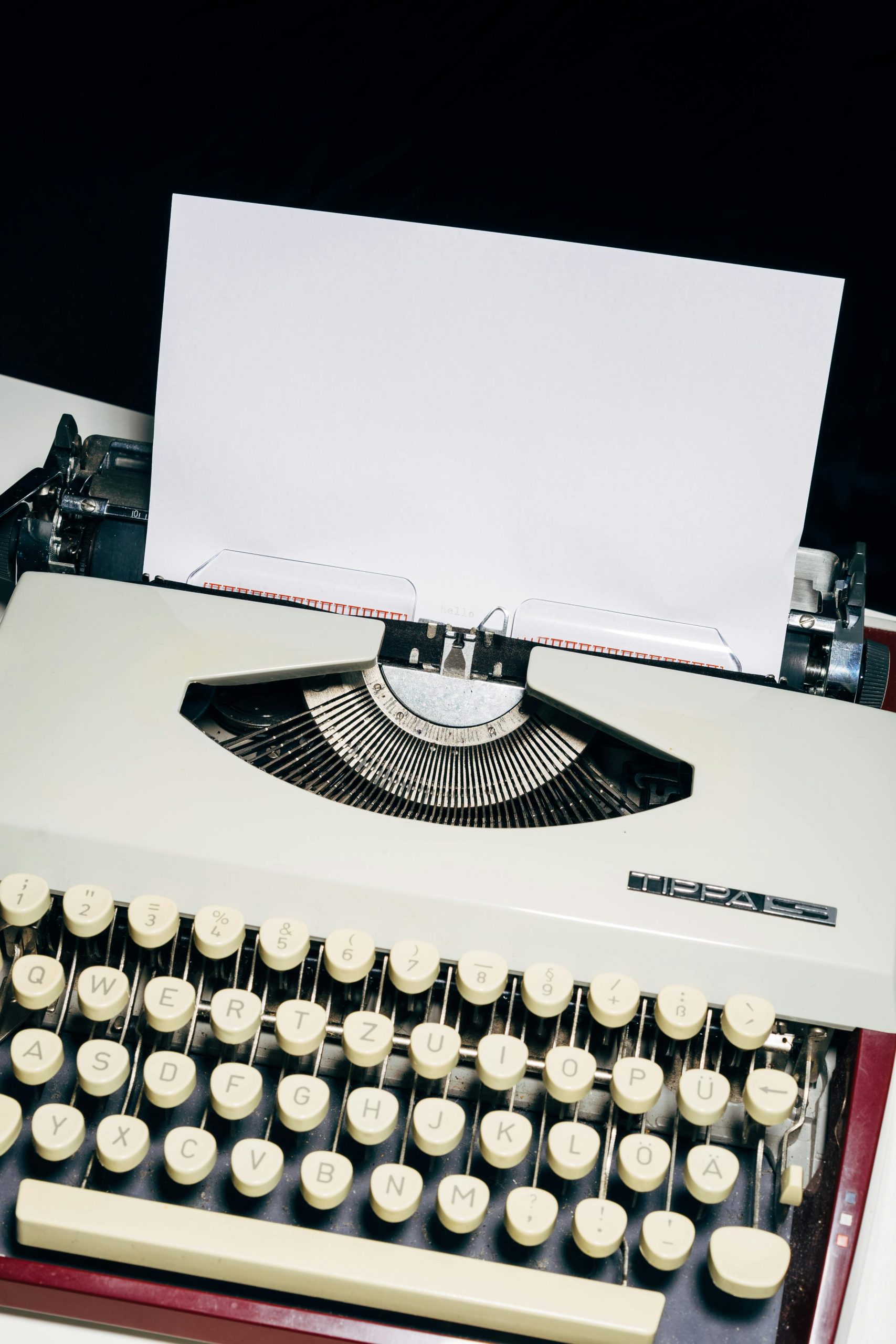 Classic vintage typewriter with blank paper ready for typing.